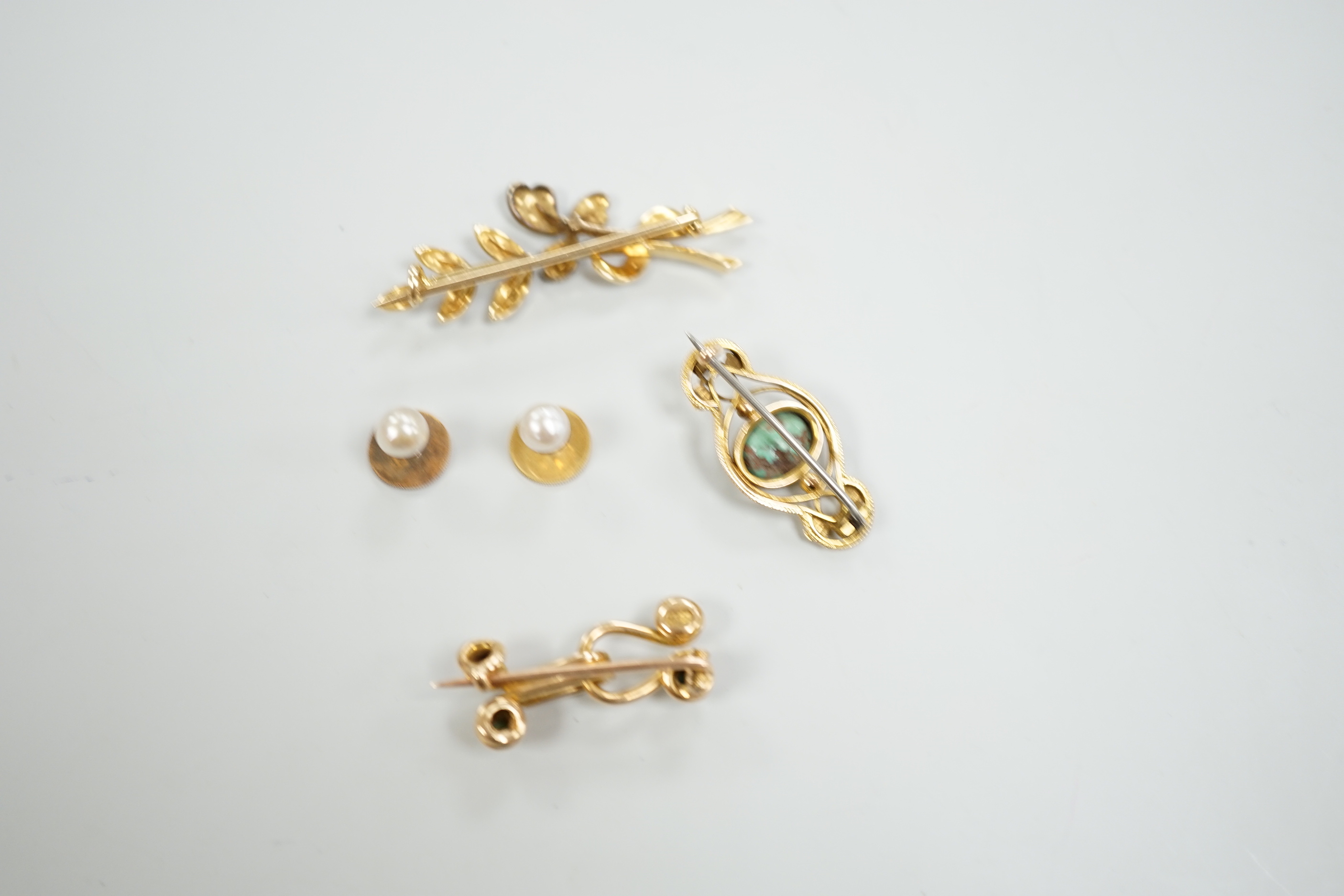 An Edwardian 15ct and seed pearl cluster set spray brooch, 47mm, a 15ct and four stone turquoise set brooch, one other yellow meta and turquoise brooch and a pair of 9ct and cultured pearl set dress studs.